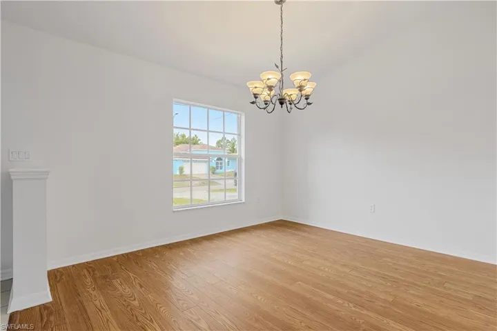 Empty room featuring a chandelier