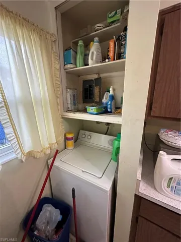 Clothes washing area with washer / clothes dryer