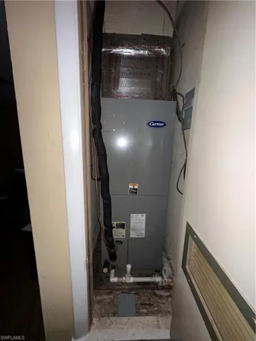Utility room featuring heating unit