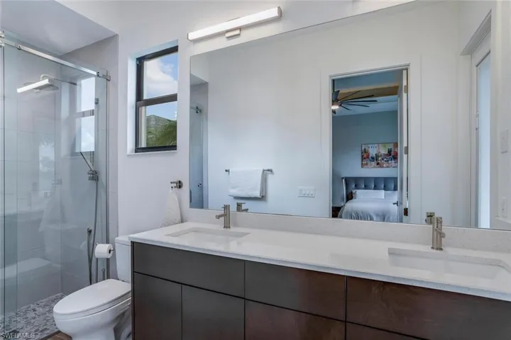 Primary Bathroom II with door to the Pool