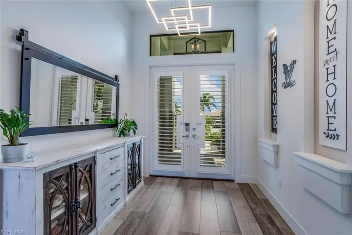 Entryway with Niches and high-end light fixtures