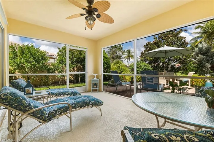 Sunroom featuring plenty of natural light and carpet floors