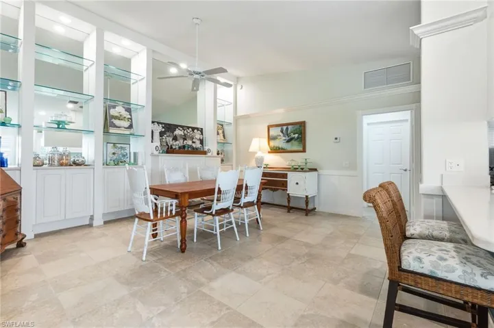 Dining room featuring lofted ceiling and a ceiling fan