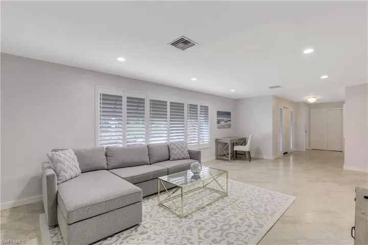 Living room featuring light tile floors