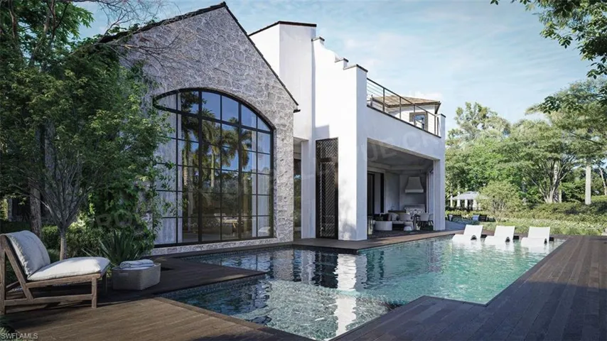Back of house featuring a patio and a balcony