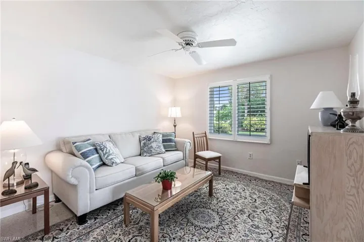 Living room featuring ceiling fan