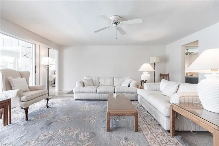 Living room featuring ceiling fan