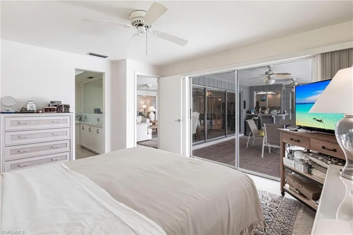 Bedroom featuring carpet flooring, access to outside, and ceiling fan