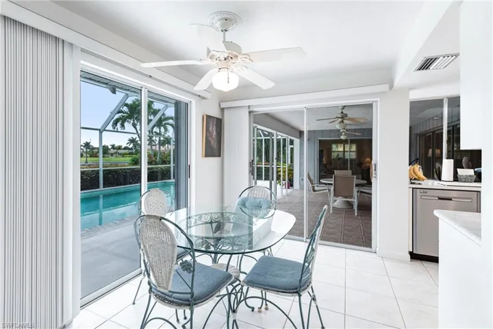 Sunroom / solarium featuring ceiling fan