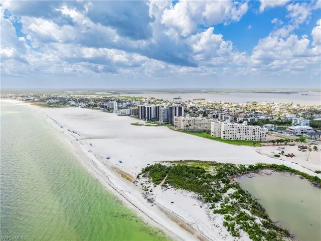 View of urban area featuring expansive beach