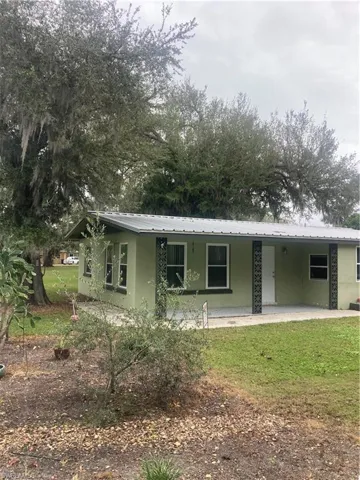 View of front of property with a front yard