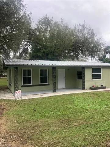 View of front of property with a front yard