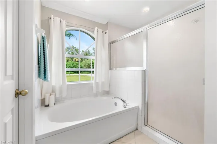 Bathroom featuring separate shower and bathtub