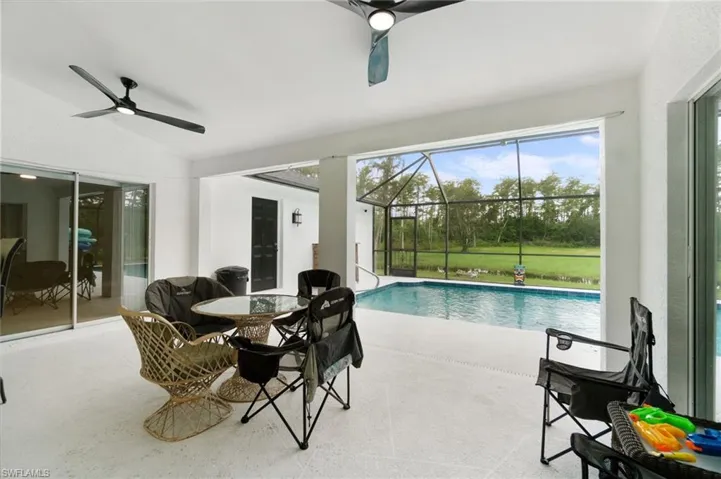 Patio with view of swimming pool