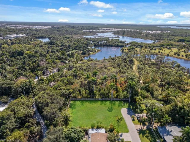 Aerial overview of property's location with a nearby body of water