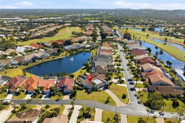 Aerial overview of property's location featuring a large body of water and nearby suburban area