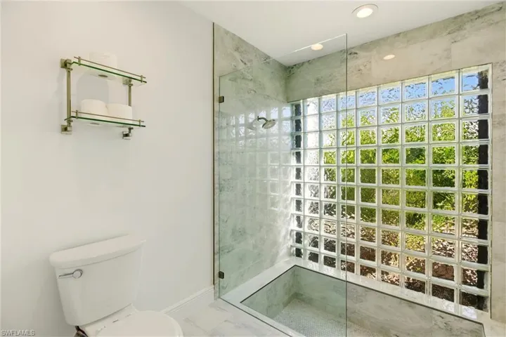 Full bathroom featuring walk in shower and recessed lighting