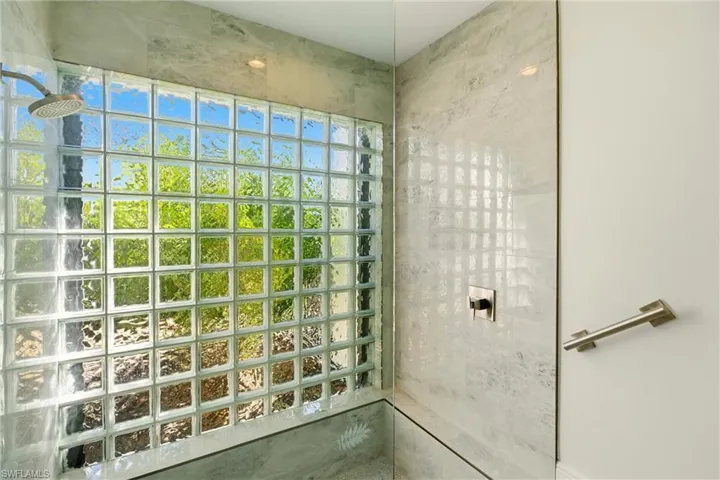 Full bath featuring a tile shower