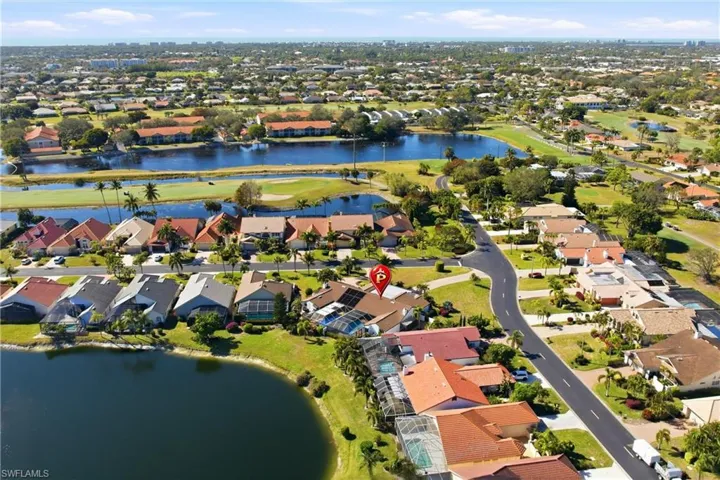 View of property location with a large body of water and nearby suburban area