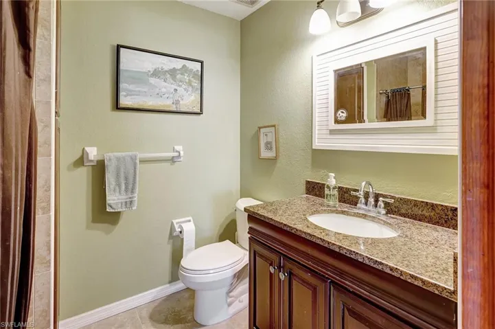Bathroom featuring vanity and shower