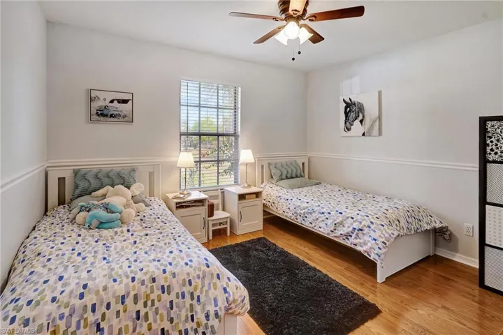 Bedroom featuring a ceiling fan and light wood-style floors