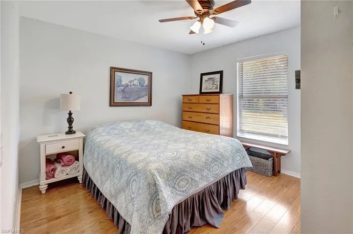 Bedroom with light wood-style flooring, and ceiling fan