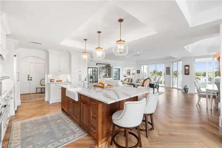 Stunning Kitchen, with two refrigerator drawers, Beautiful Cortitz countertops and backsplash, new cabinets with storage galore all set upon a wood look tile flooring.