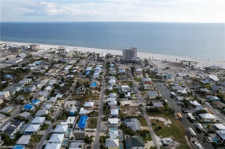 Aerial view with a beach view and a water view