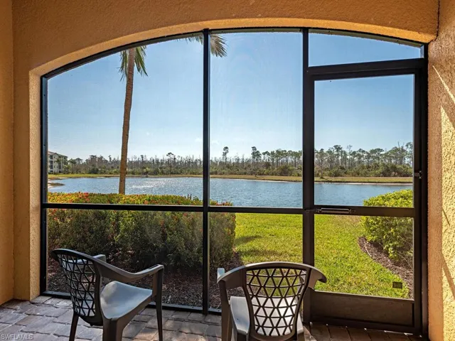 Sunroom with a water view