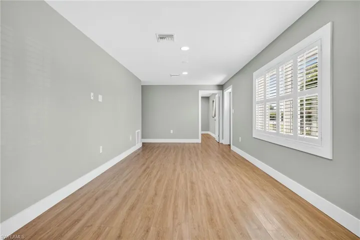 Unfurnished room featuring light wood finished floors and recessed lighting