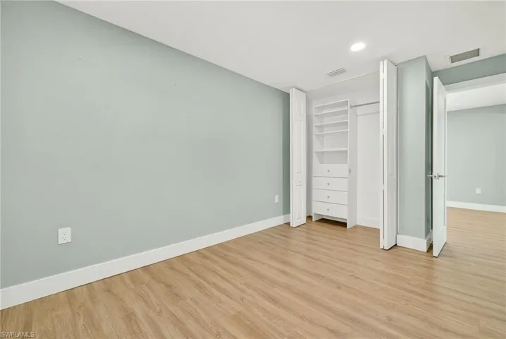 Unfurnished bedroom featuring light wood finished floors and recessed lighting