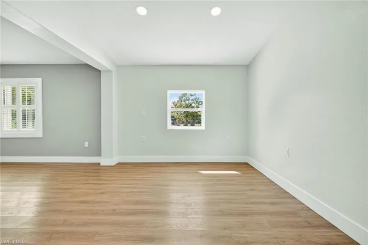 Spare room featuring light wood-style floors and recessed lighting