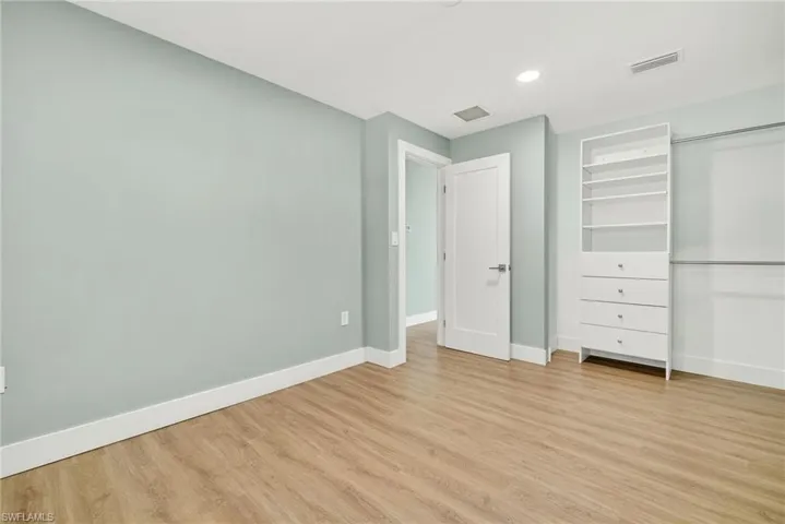 Unfurnished bedroom featuring light wood-type flooring and recessed lighting