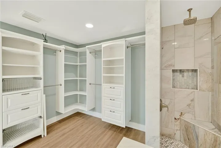 Spacious closet with light wood-type flooring
