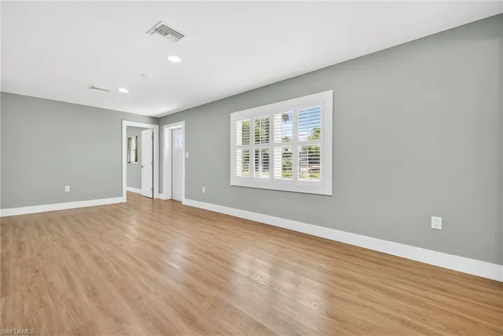 Empty room featuring recessed lighting and light wood-type flooring