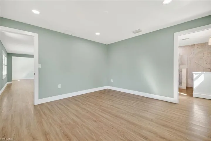 Unfurnished room featuring light wood finished floors and recessed lighting