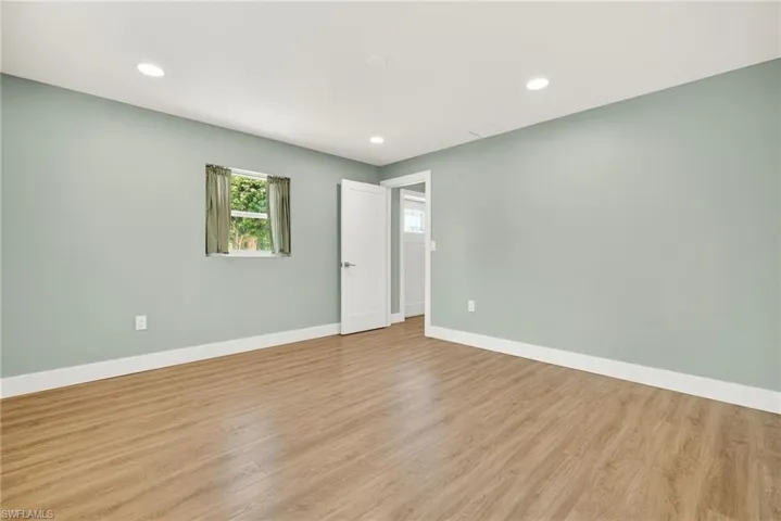 Unfurnished room with recessed lighting and light wood finished floors