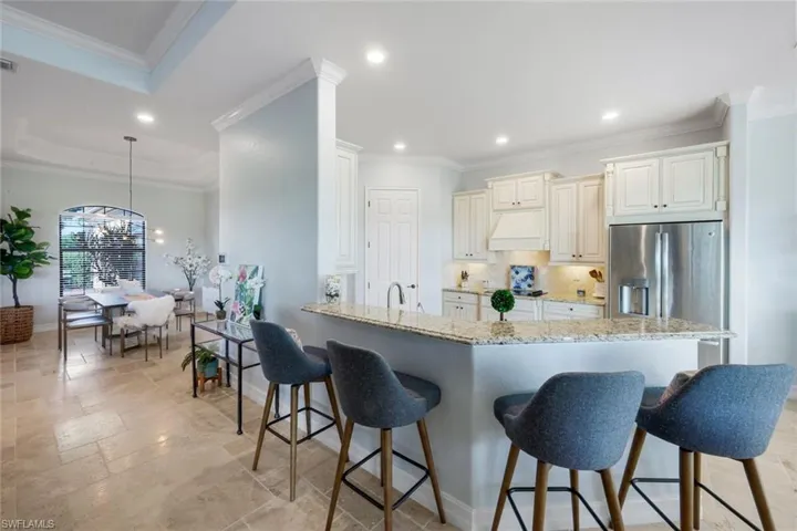 Recessed lights and crown molding detail. Kitchen seating space for 4 barstools! A wonderful home to entertain in!