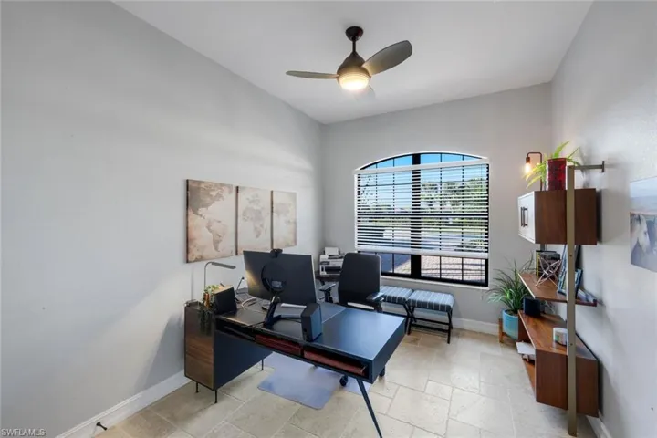 Den/Office on first floor just off the foyer area with ceiling fan/ light and large open window!