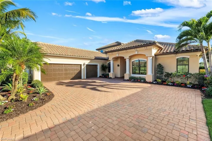 Ample parking space with a pristine paver driveway and 3 car garage!