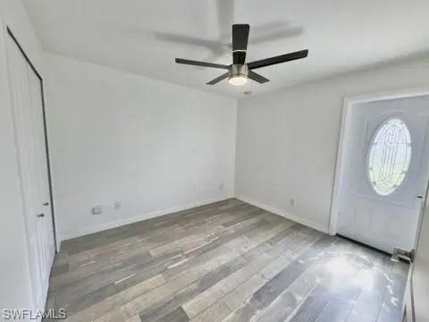 Foyer entrance featuring light hardwood / wood-style floors and ceiling fan