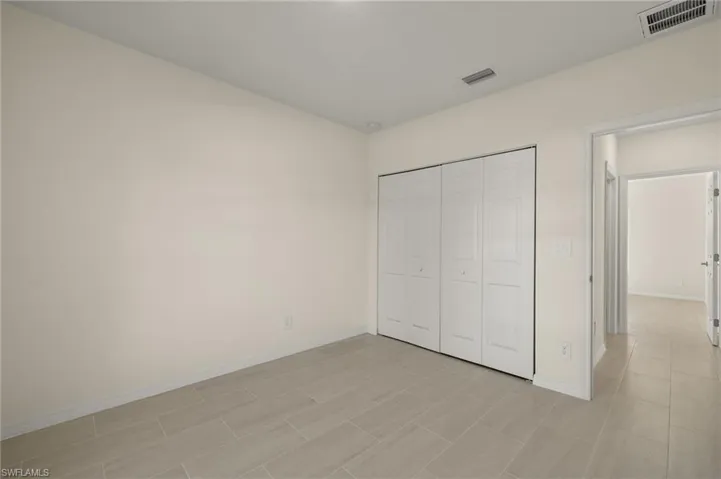 Unfurnished bedroom featuring a closet