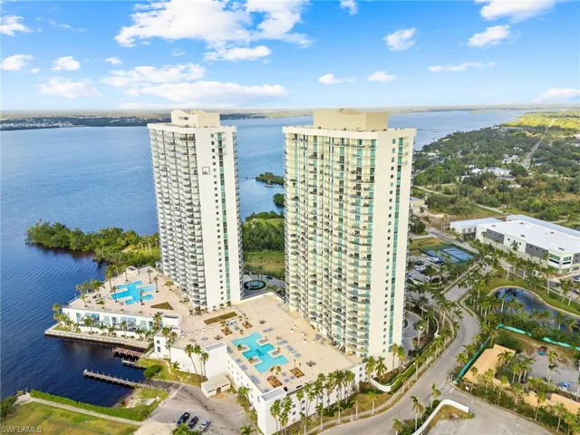 Aerial view of apartment complex and a large body of water