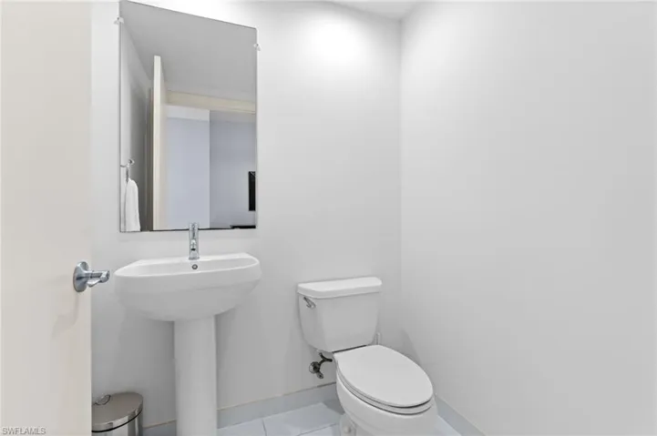 Bathroom featuring toilet and light tile patterned floors