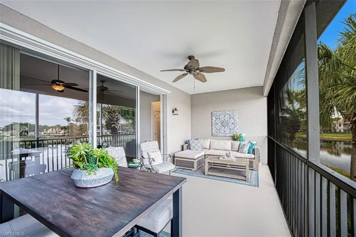 Sunroom with a water view, outdoor lounge area, plenty of natural light, and ceiling fan