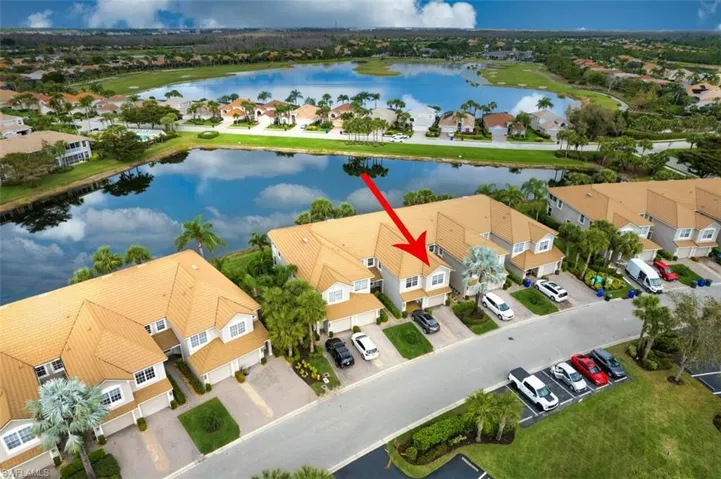 Aerial perspective of suburban area featuring a large body of water