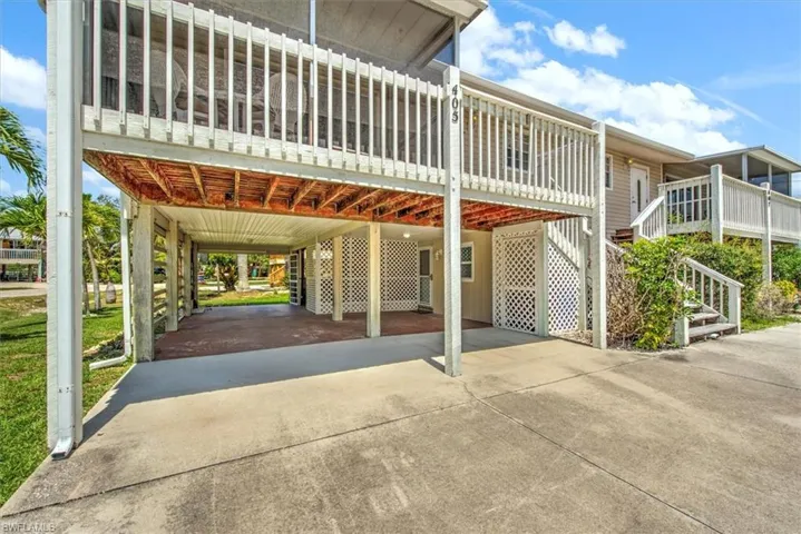 View of vehicle parking with a carport