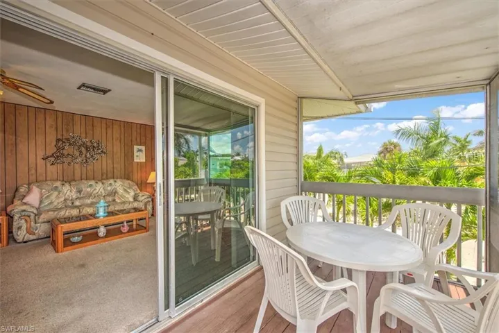 Sunroom / solarium with ceiling fan and a wealth of natural light