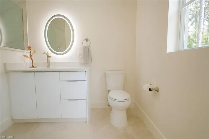Bathroom with vanity and light tile patterned floors