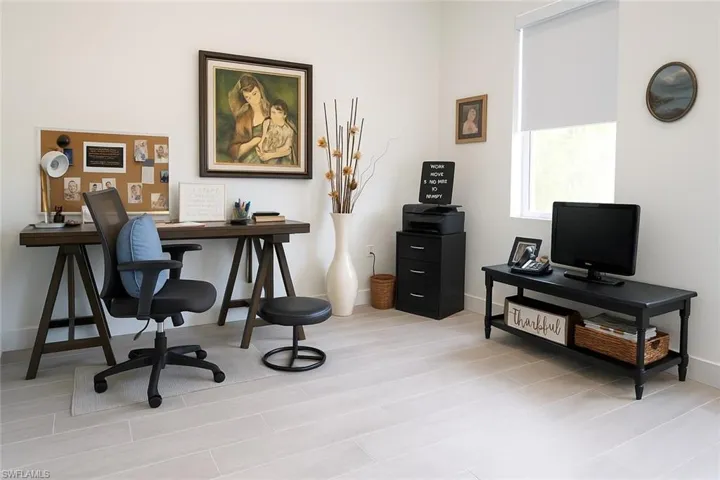 Office featuring baseboards and light wood-style flooring